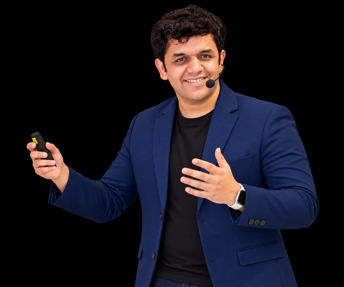 Siddhesh Joglekar presenting to an audience with a headset microphone